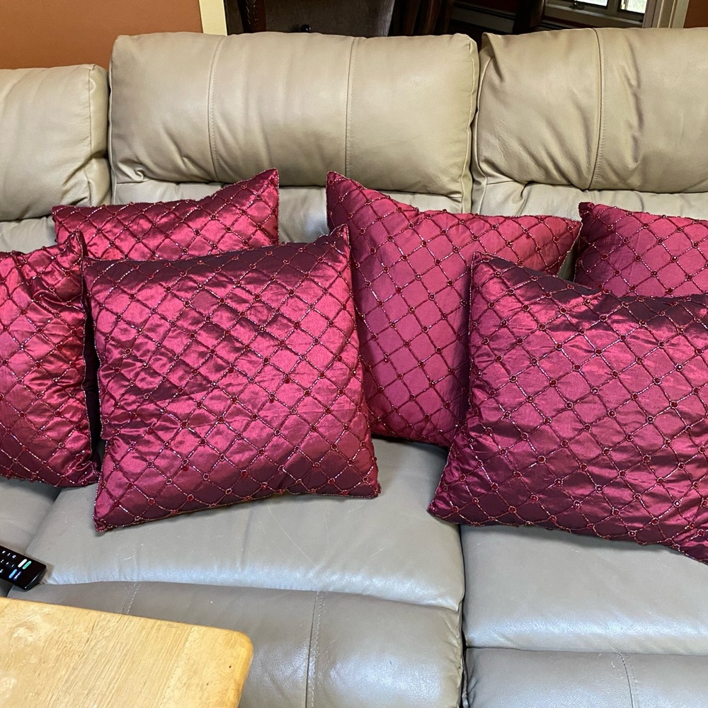 Six glamorous beaded vintage pillows on silk like material.
